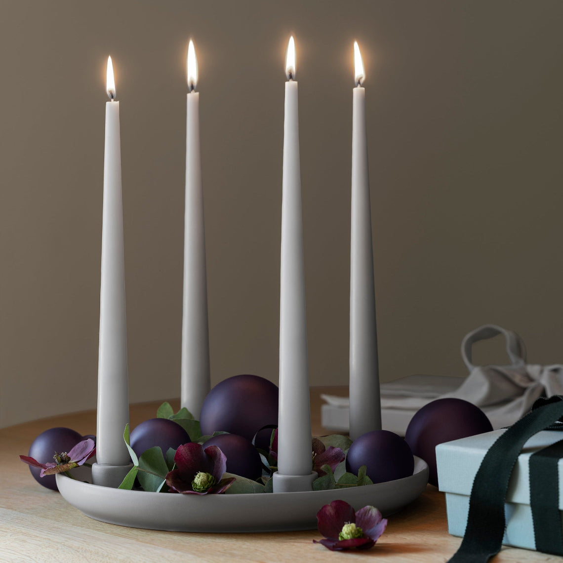 JUHLA deep plum ball ornaments decorating an advent candle by blomus