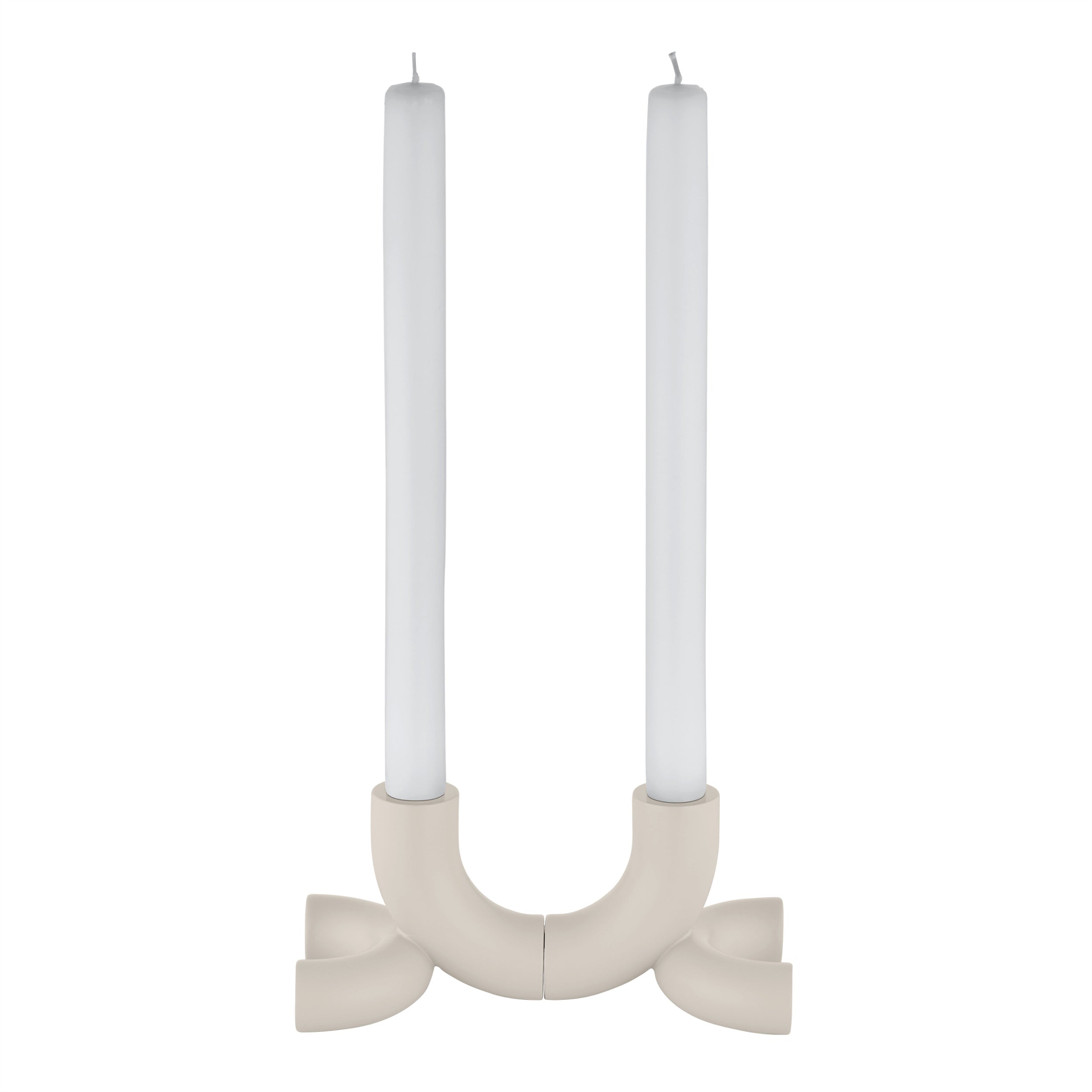 DOODLE Candle Holder placed together with white candles.