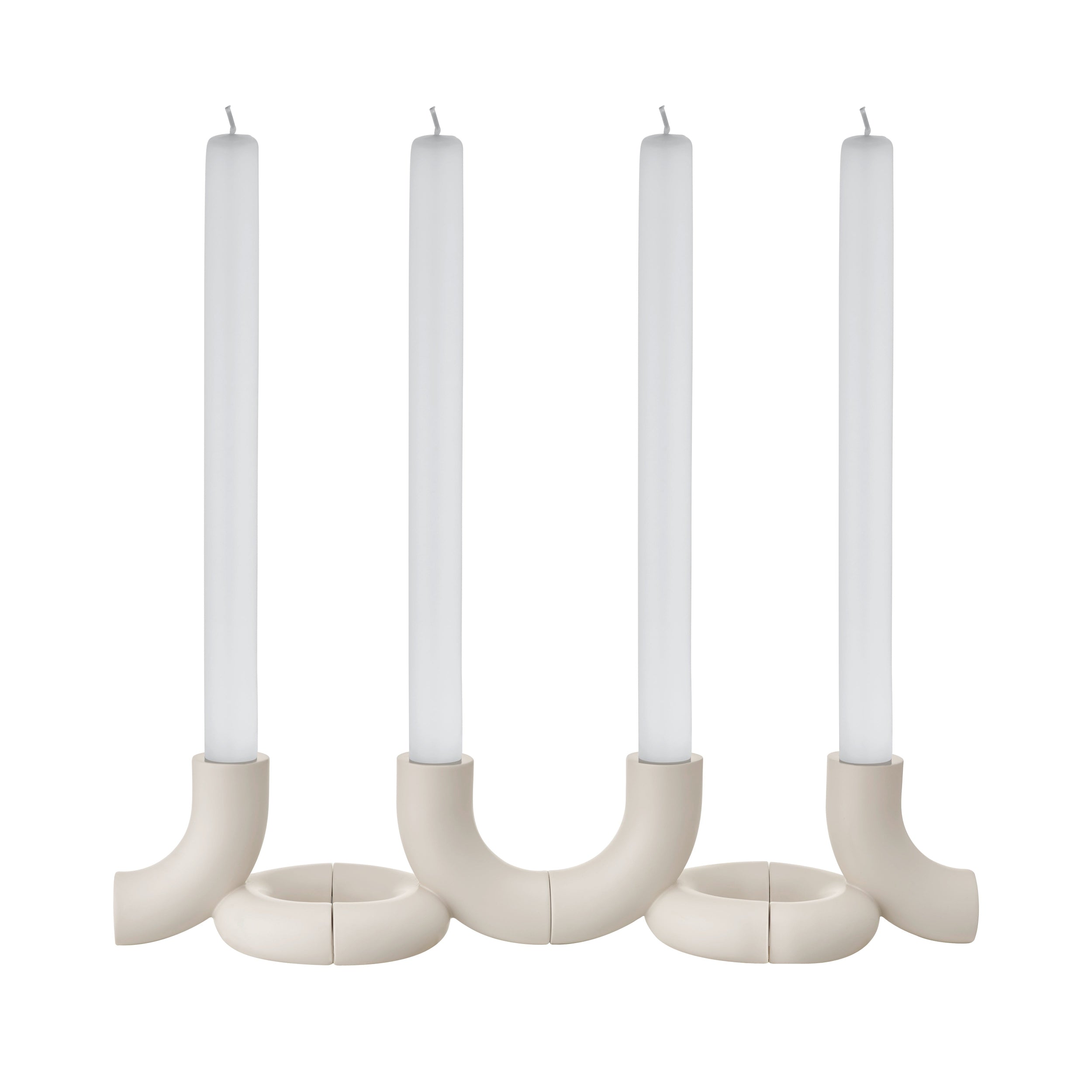 Set of four Moonbeam Doodle candle holders with candles on a white background