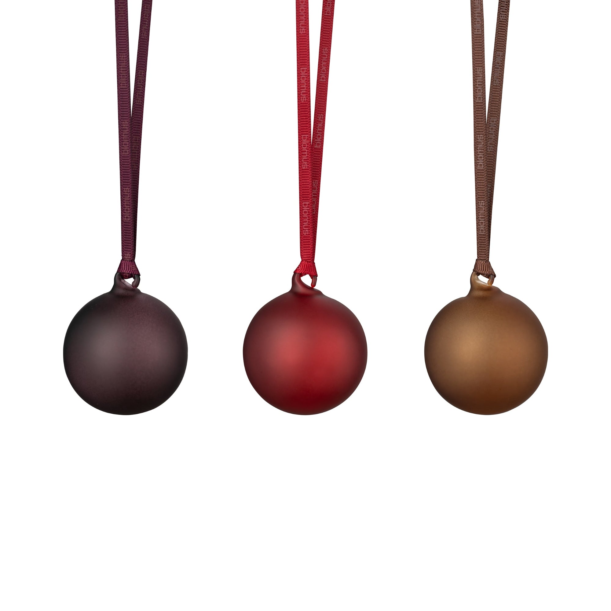 67154 Three Christmas ornaments in plum, port and brown on ribbons against a white background