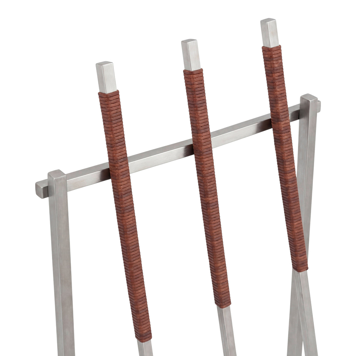 A close-up of fireplace tools with leather cord wrapped handles, shown against a plain white background.