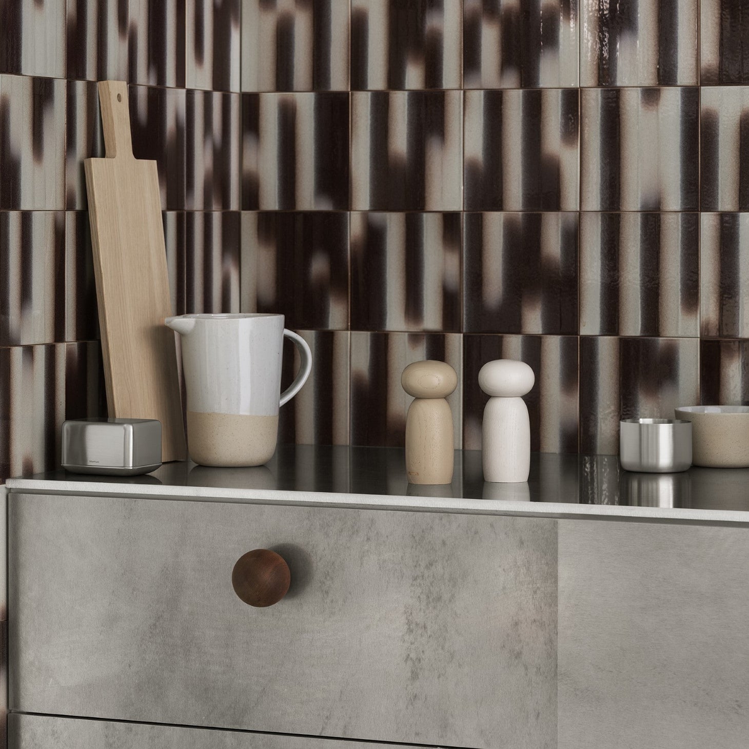 blomus MOLI adjustable spice grinders displayed on an elegant counter top with other kitchen accessories