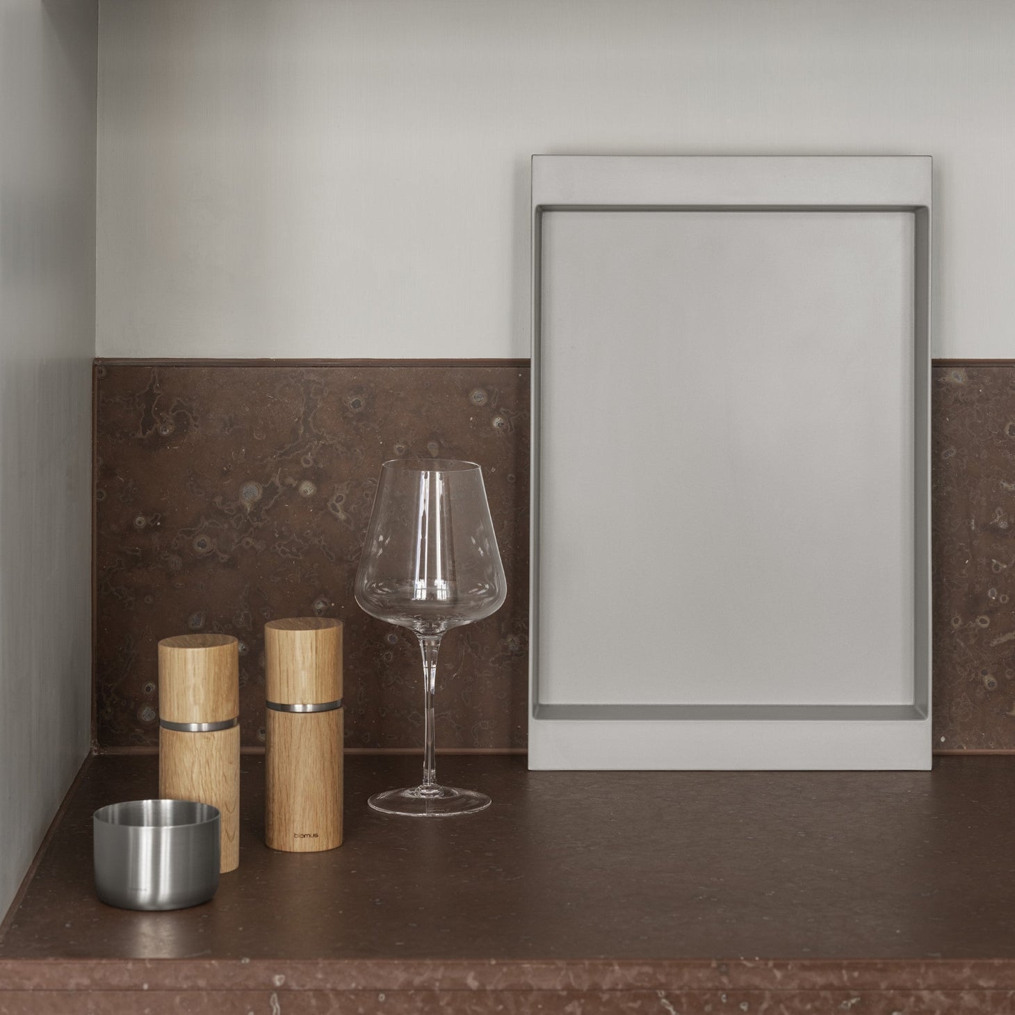 blomus PEPE adjustable salt and pepper grinders with aluminum accent on marble countertop