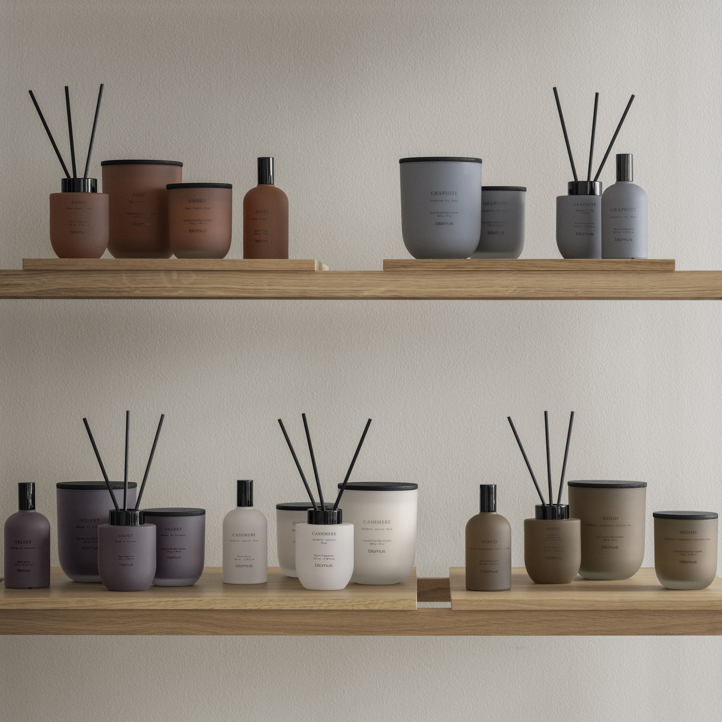 Several Fragrances and types of scent dispensers together on a shelf.