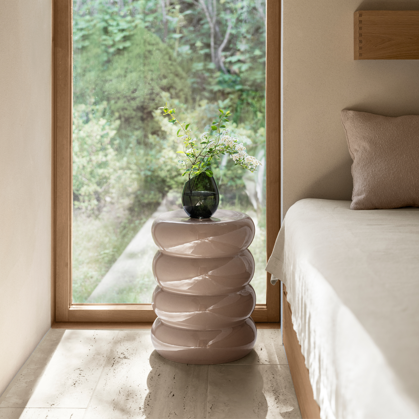 blomus TORU side table in front of a window in a minimalist bedroom