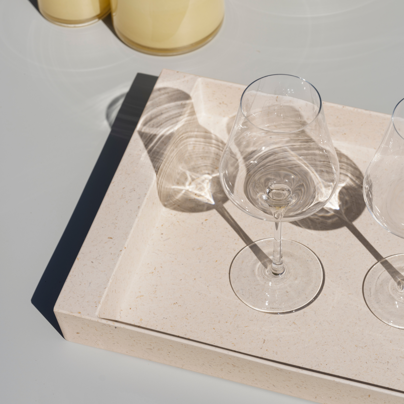 blomus KANKYO recycled bamboo tray with wine glasses in the bright sun