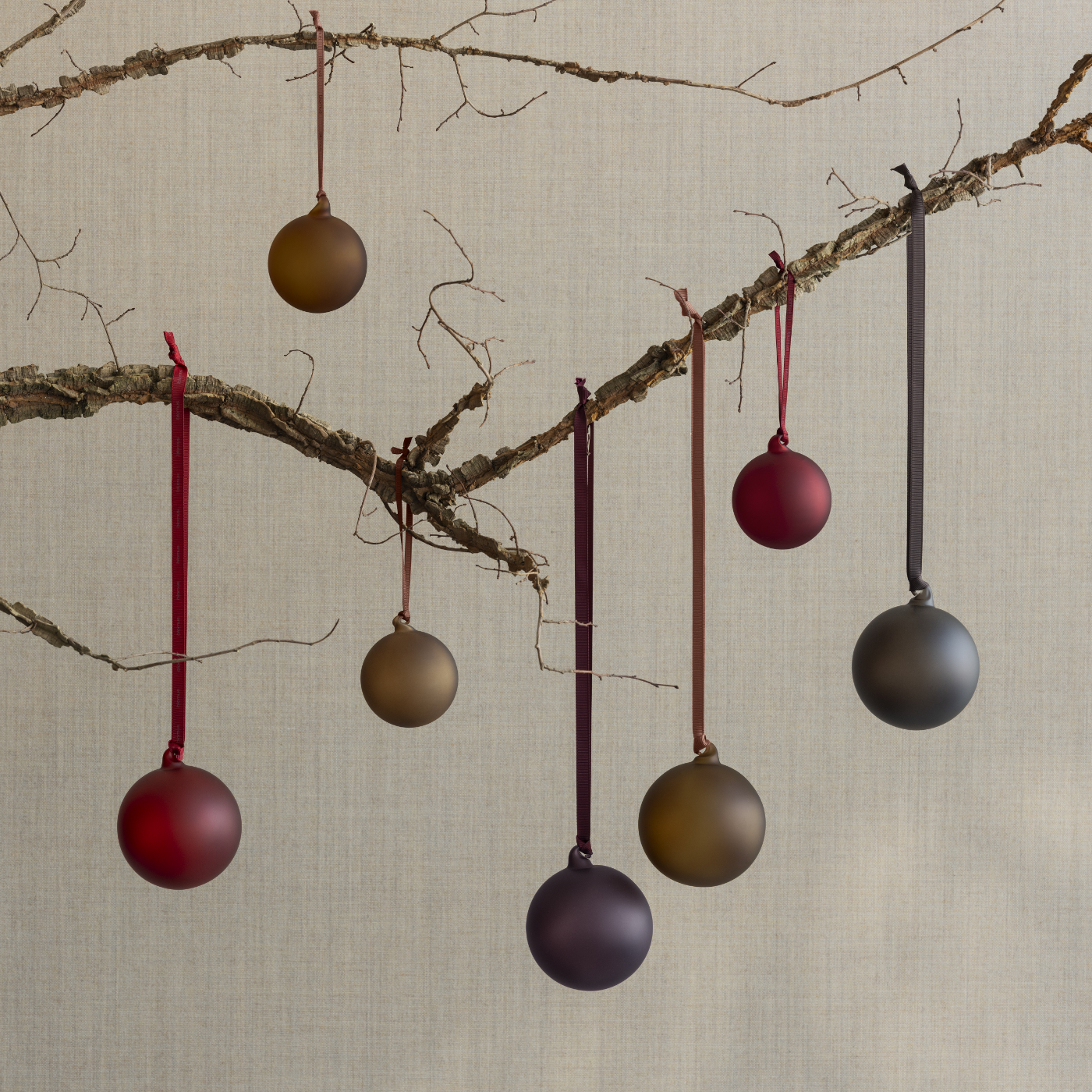 blomus JUHLA handblown glass ornaments hanging on branch for a classic modern Christmas look