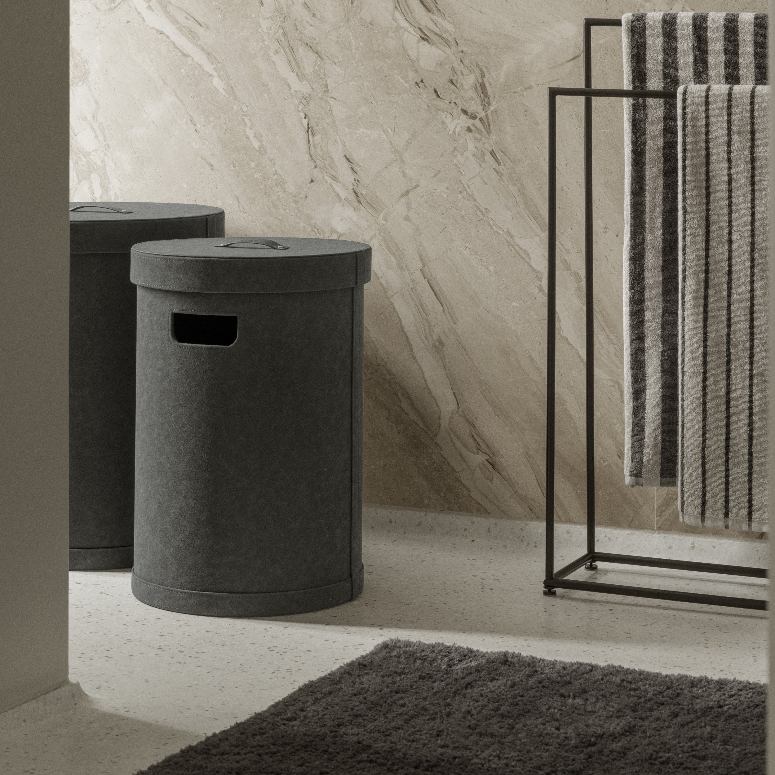 SAHLA Storage Bin in a bathroom setting with marble wall and towel rack.