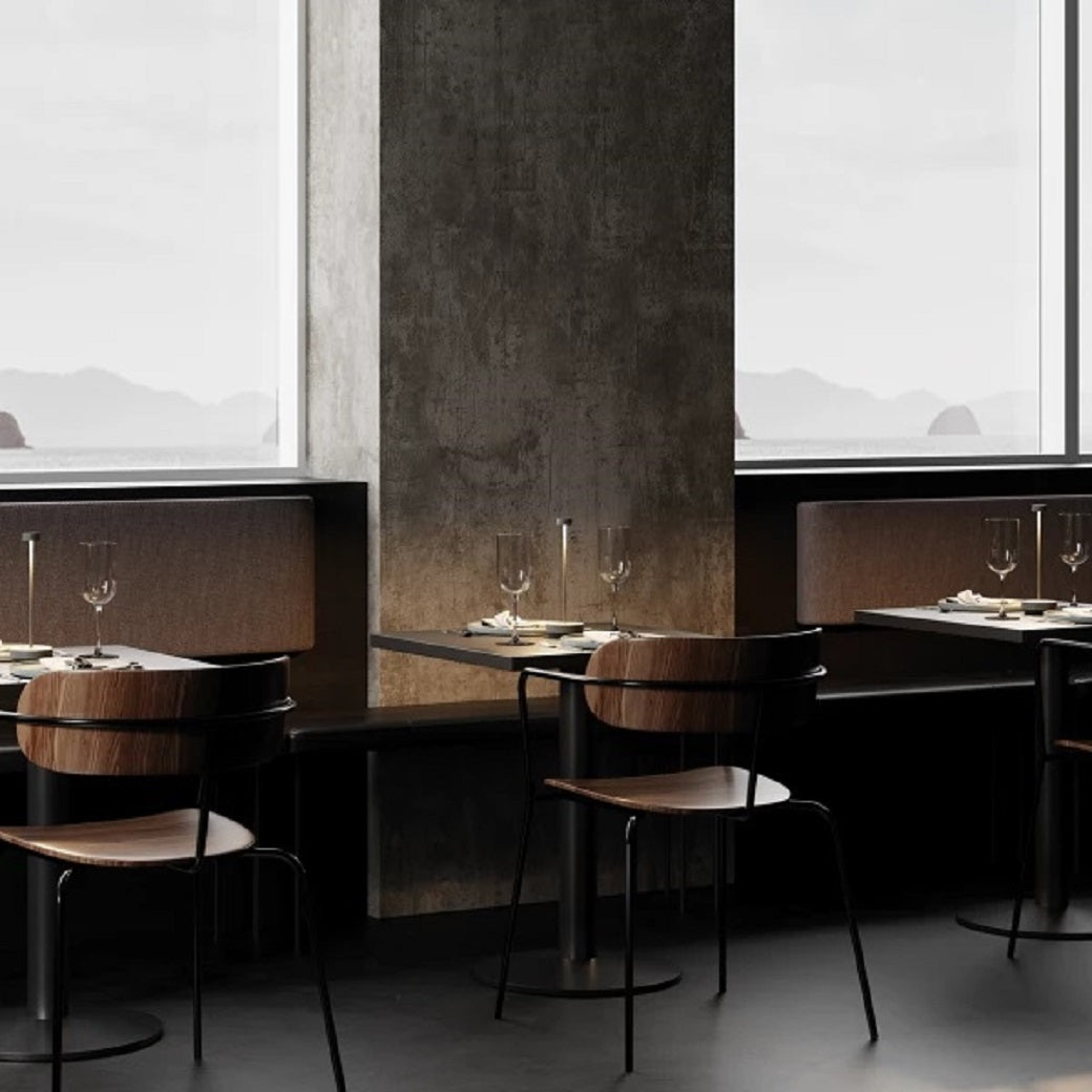 Posh restaurant setting with dining tables lit by LED table lamps