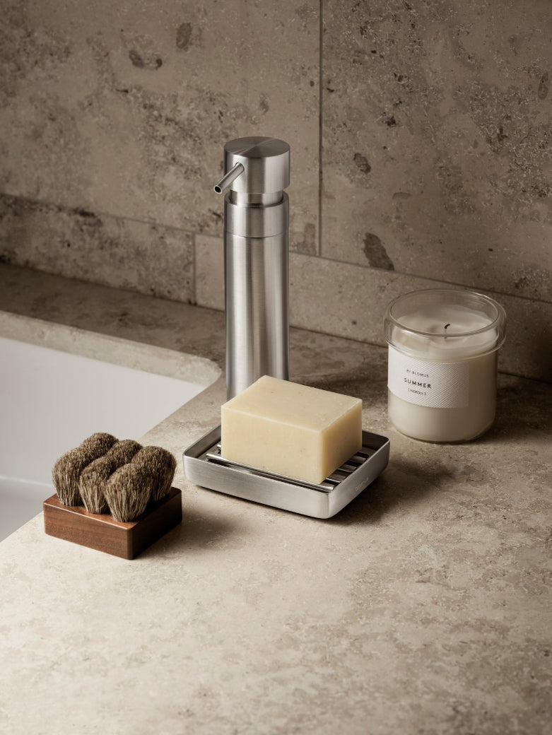 VALOA Candle Lifestyle Image on Bathroom Countertop with soap holder and soap dispenser
