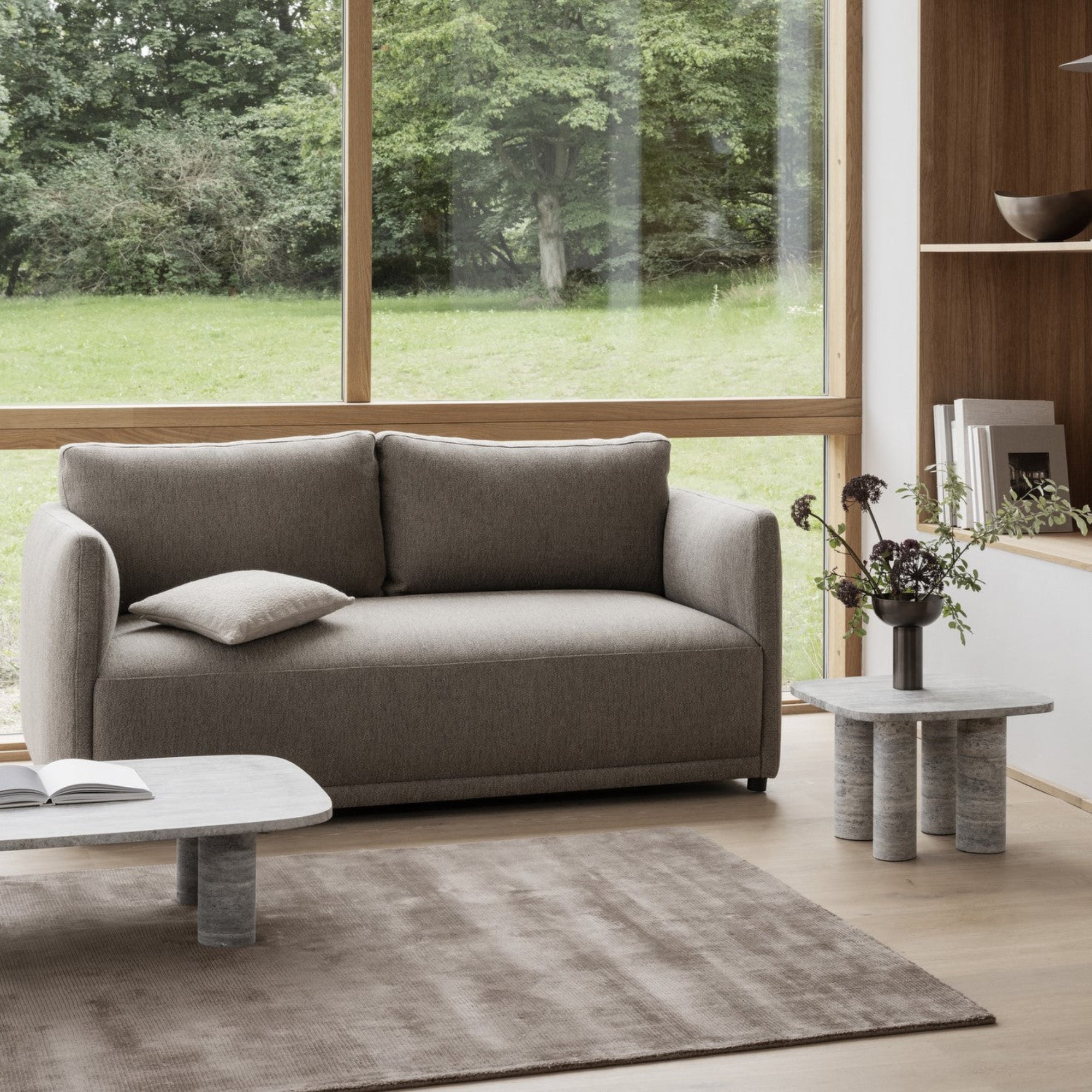 VISCA Area Rug in a cozy sitting area by large windows