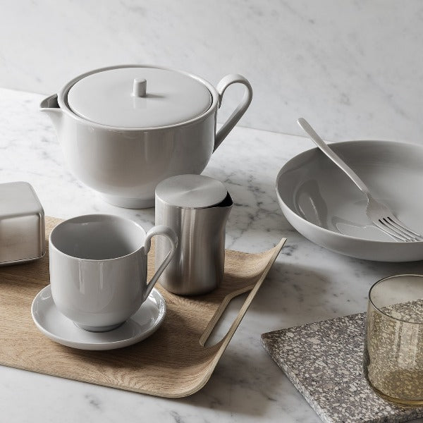 marble counter top set for morning tea with blomus BASIC stainless steel milk creamer container and teacups