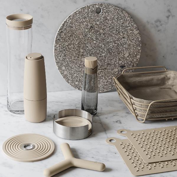 marble counter top displaying kitchen accessories with blomus FLIP silicone trivet in front