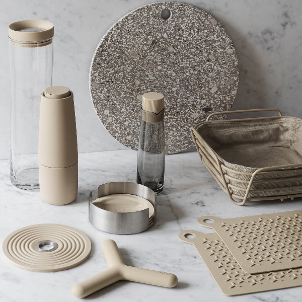 modern kitchen accessories from blomus featuring SPLASH handblown water carafe on a marble kitchen counter