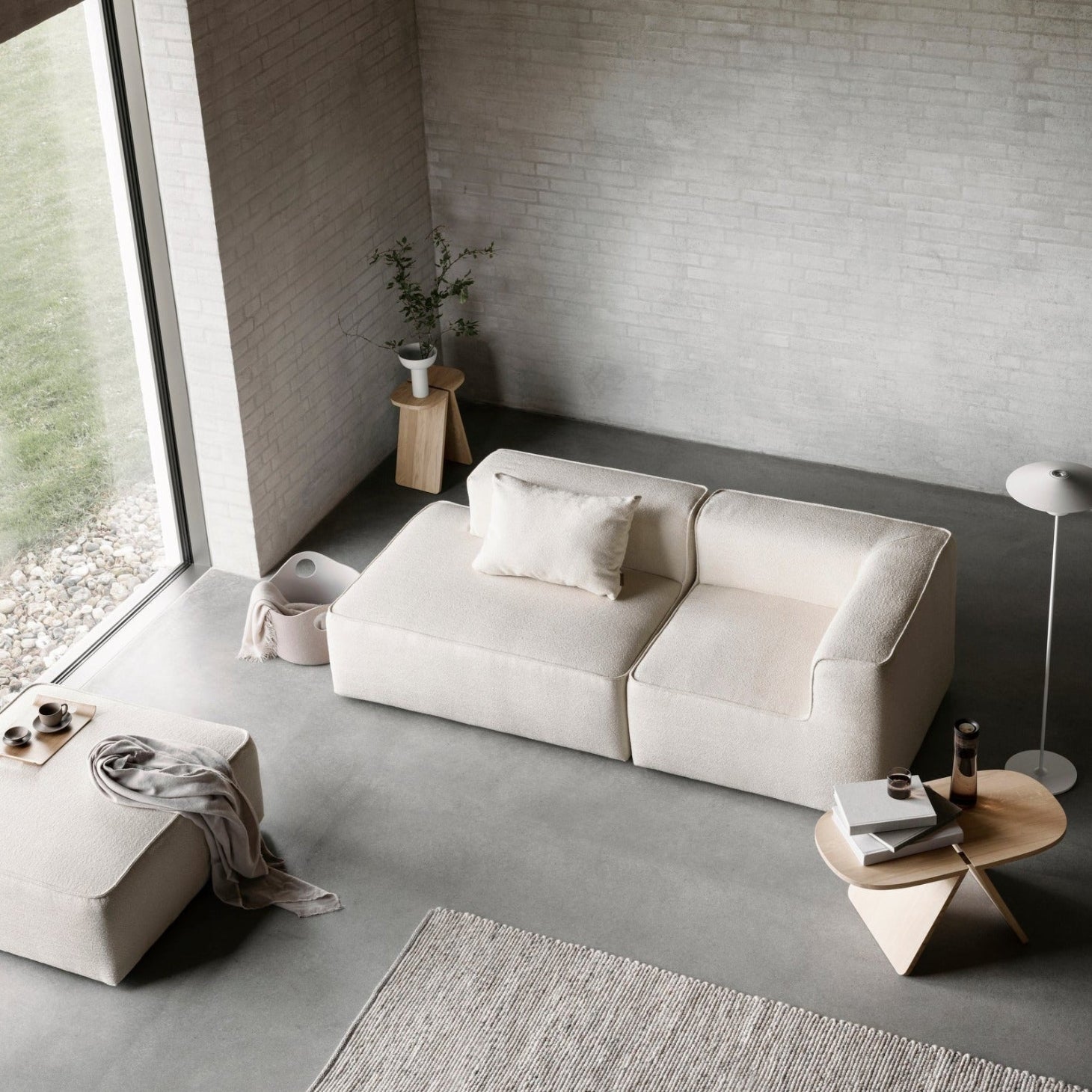 modern minimalist living room with solid oak coffee table and side table by blomus