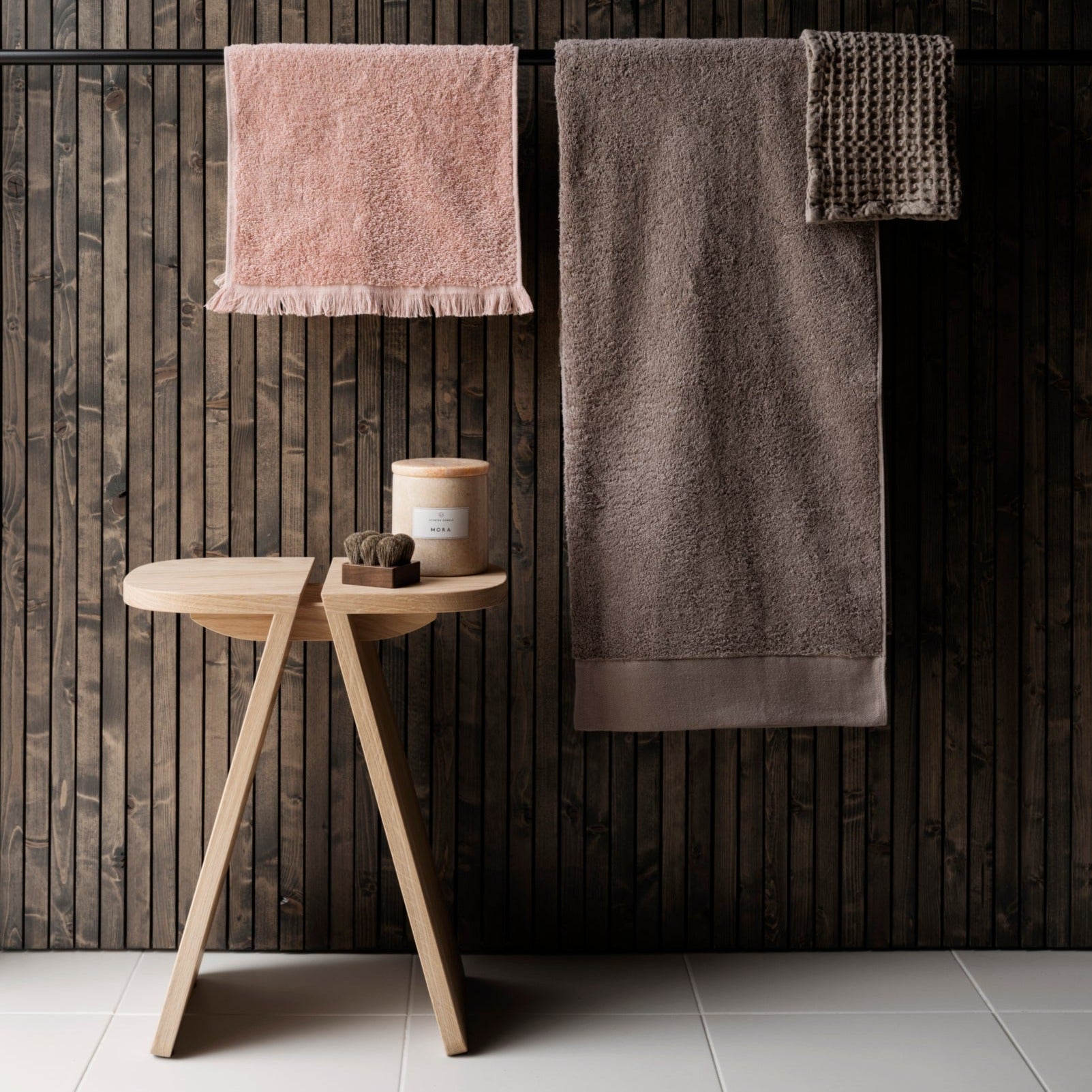 Simple bathroom setting with hanging terry cloth cotton towels
