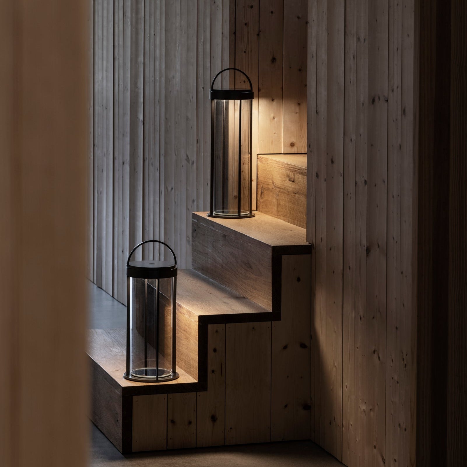 Wooden stairs lit by the warm glow of led lanterns
