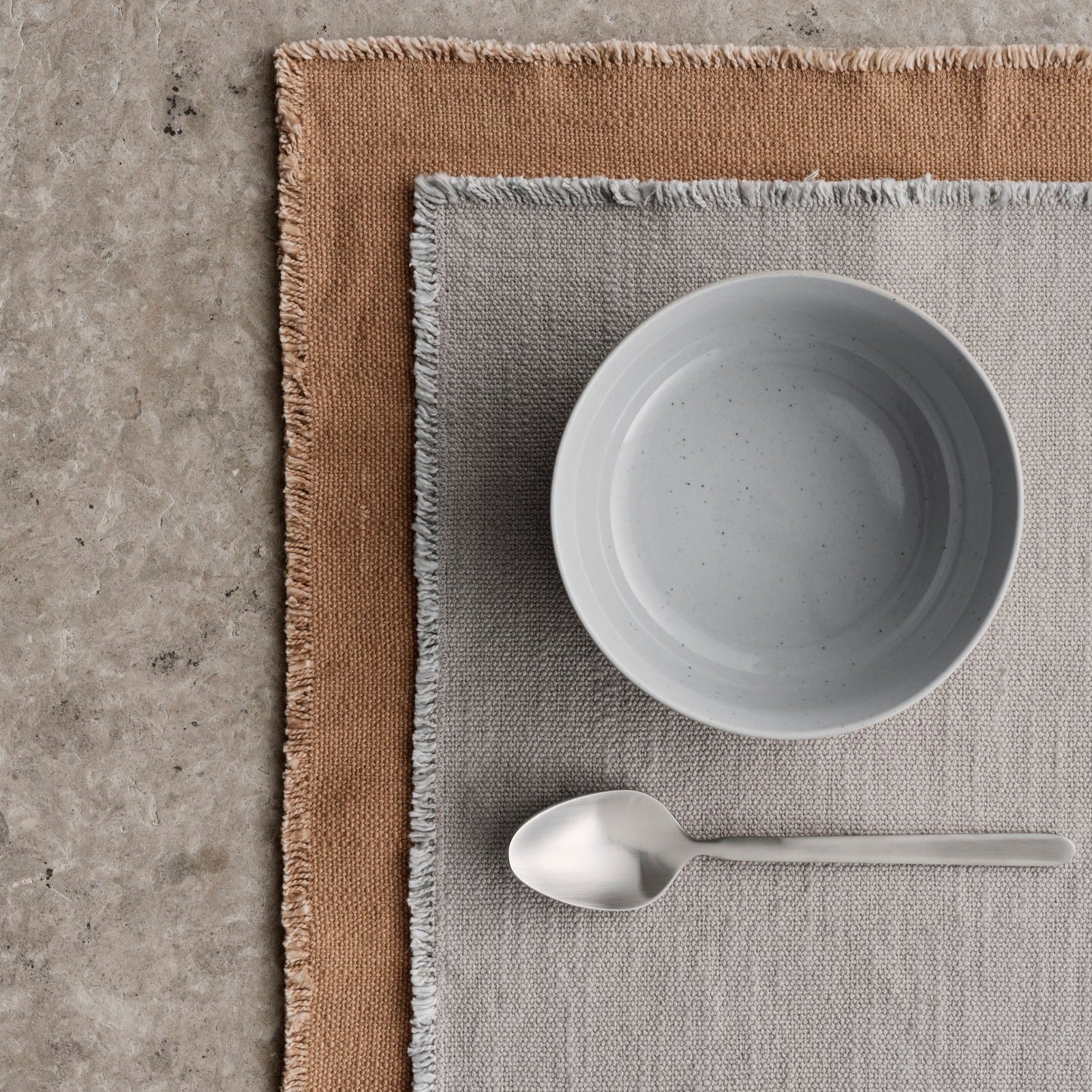 simple breakfast table setting with blomus LINEO cotton placemats layered for a modern touch