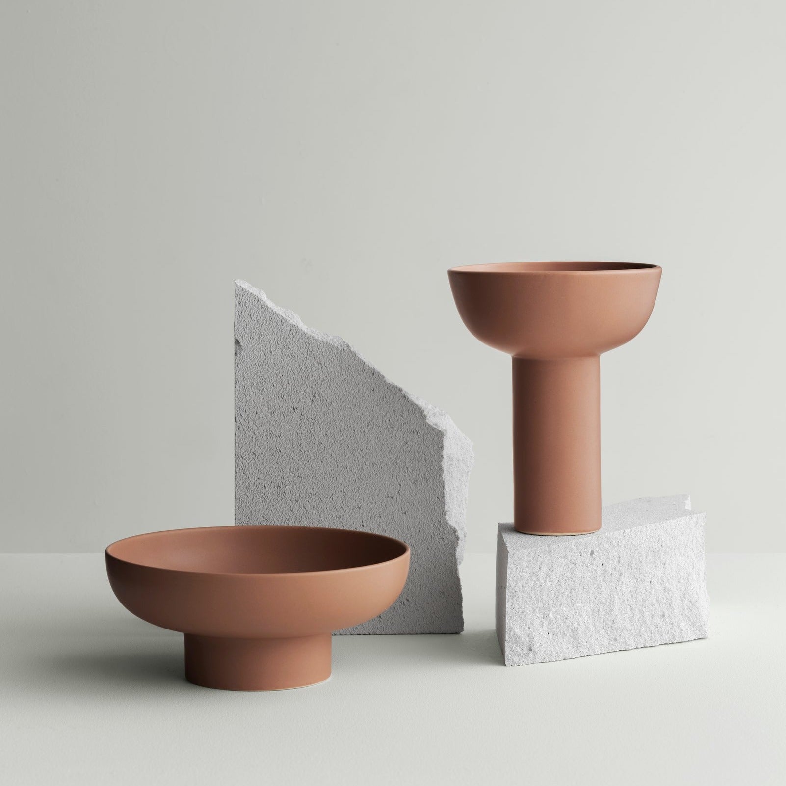 blomus MIYABI vases in terracotta color displayed on broken granite