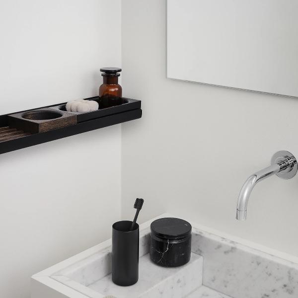 Modern bath wall shelf over marble sink
