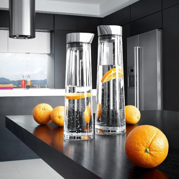 blomus ACQUA glass water carafe with stainless steel lid featured in a modern kitchen