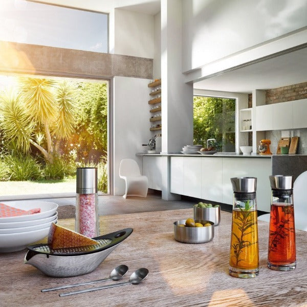 blomus NAVETTA Parmesan Cheese Grater with Bowl on a modern wood table in a chic dining room