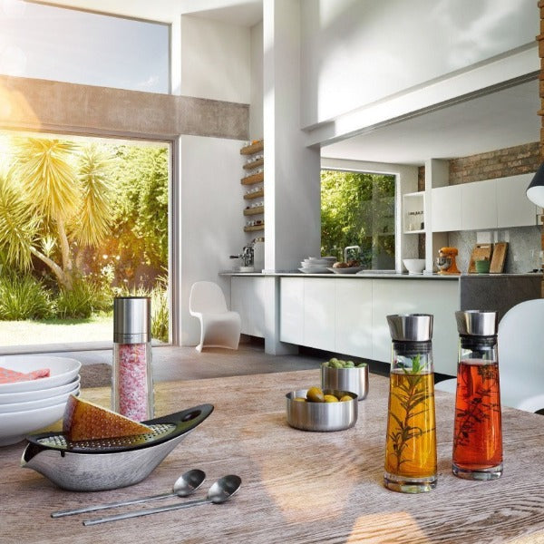 spacious modern kitchen scene featuring blomus ALINJO glass oil and vinegar set with stainless steel lids