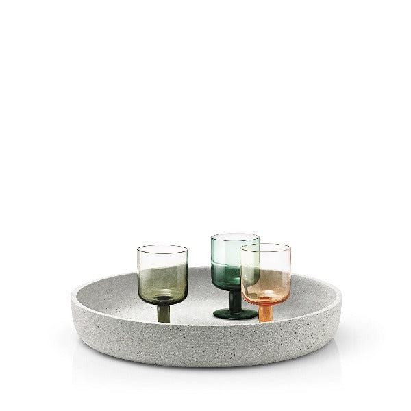Decorative concrete bowl with colored wine glasses