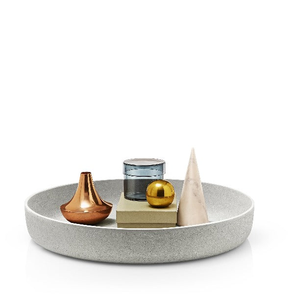 modern decor bowl containing shiny toy objects