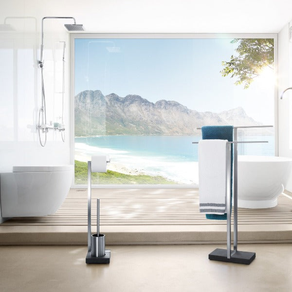 Stainless steel toilet butler with brush and roll holder in a modern oceanside bathroom with view