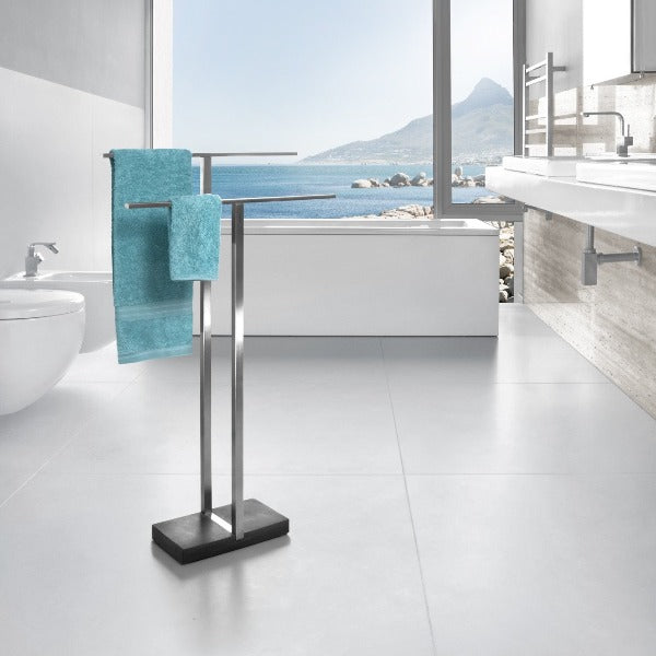 modern oceanside bathroom with brushed stainless towel rack from blomus featured in the middle