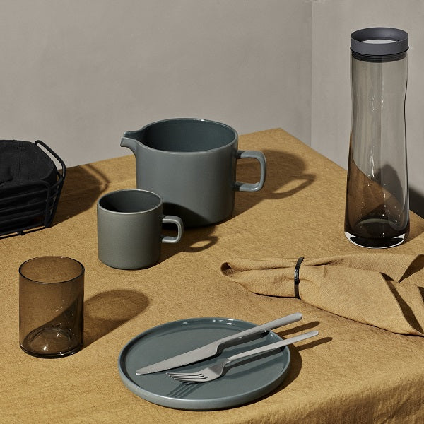 minimalist tabletop arrangement of blomus PILAR ceramic dinnerware displaying the matte exterior and durable glazed interior of each dish