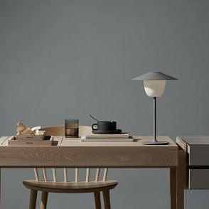 Wooden dining table set for morning coffee with an led lamp