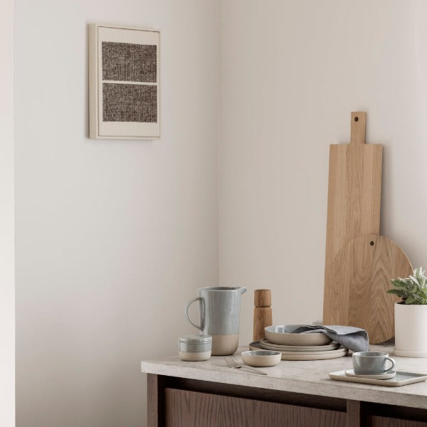 post modern marble top credenza with simple arrangement of SABLO ceramic dinnerware by BLOMUS European design