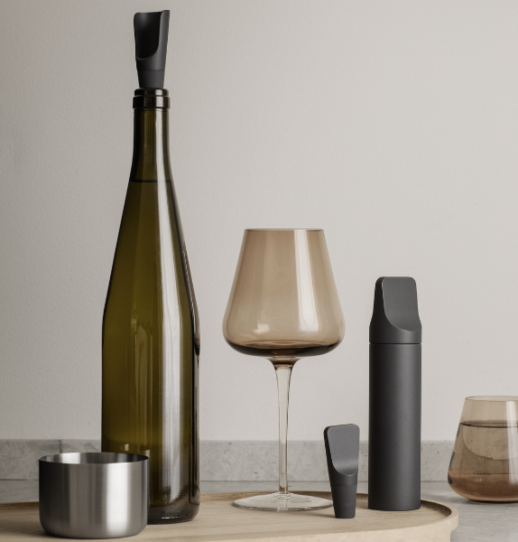elegant wine bottle and glass with modern ILO wine accessories by blomus