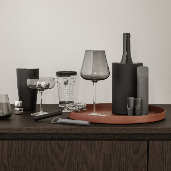 blomus modern minimalist barware featuring sleek BELO wine glasses on a walnut credenza