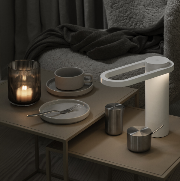 breakfast tea near a cozy armchair with dim light from VEN glass candle holder