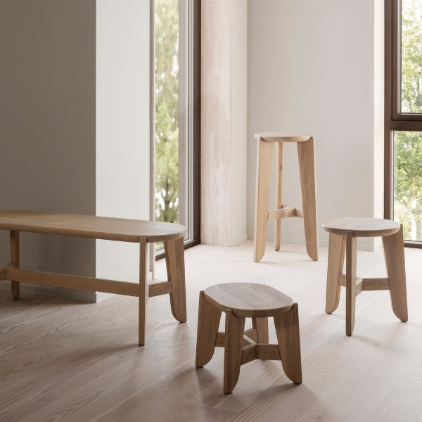 blomus ELI series of simple oak benches and stools in an airy room with windows