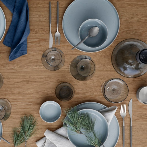 Styled tabletop featuring blomus SABLO collection in Stone, modern ceramic plates and bowls