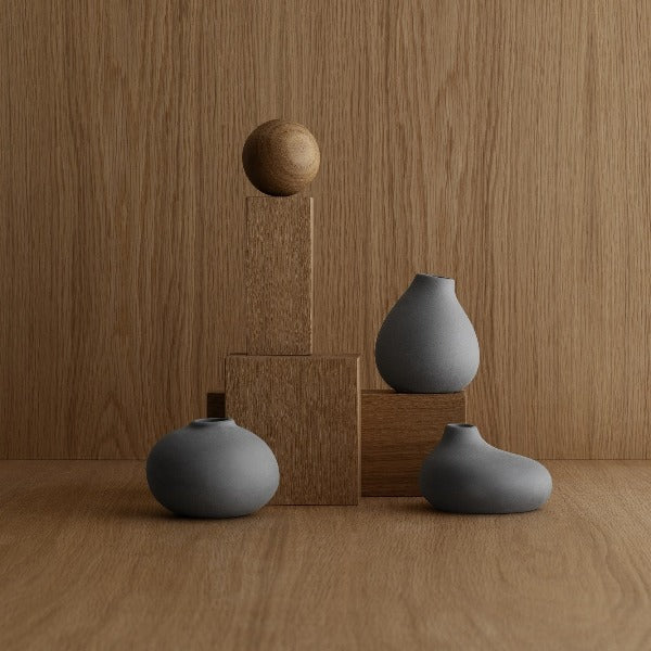 modern artistic wood blocks and sphere with NONA porcelain vases in charcoal color