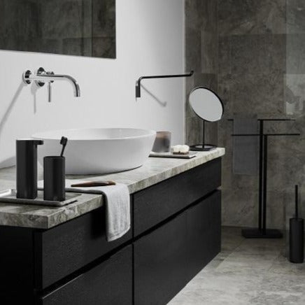 Simple black wall mounted towel rail in a chic modern bathroom