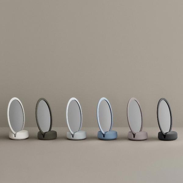 six colors of blomus vanity mirror in front of a neutral background