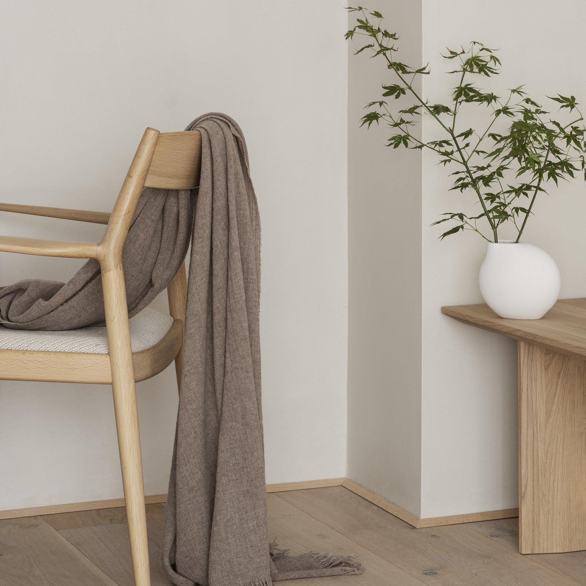 white blomus NONA vase featured in a modern minimalist home decor setting