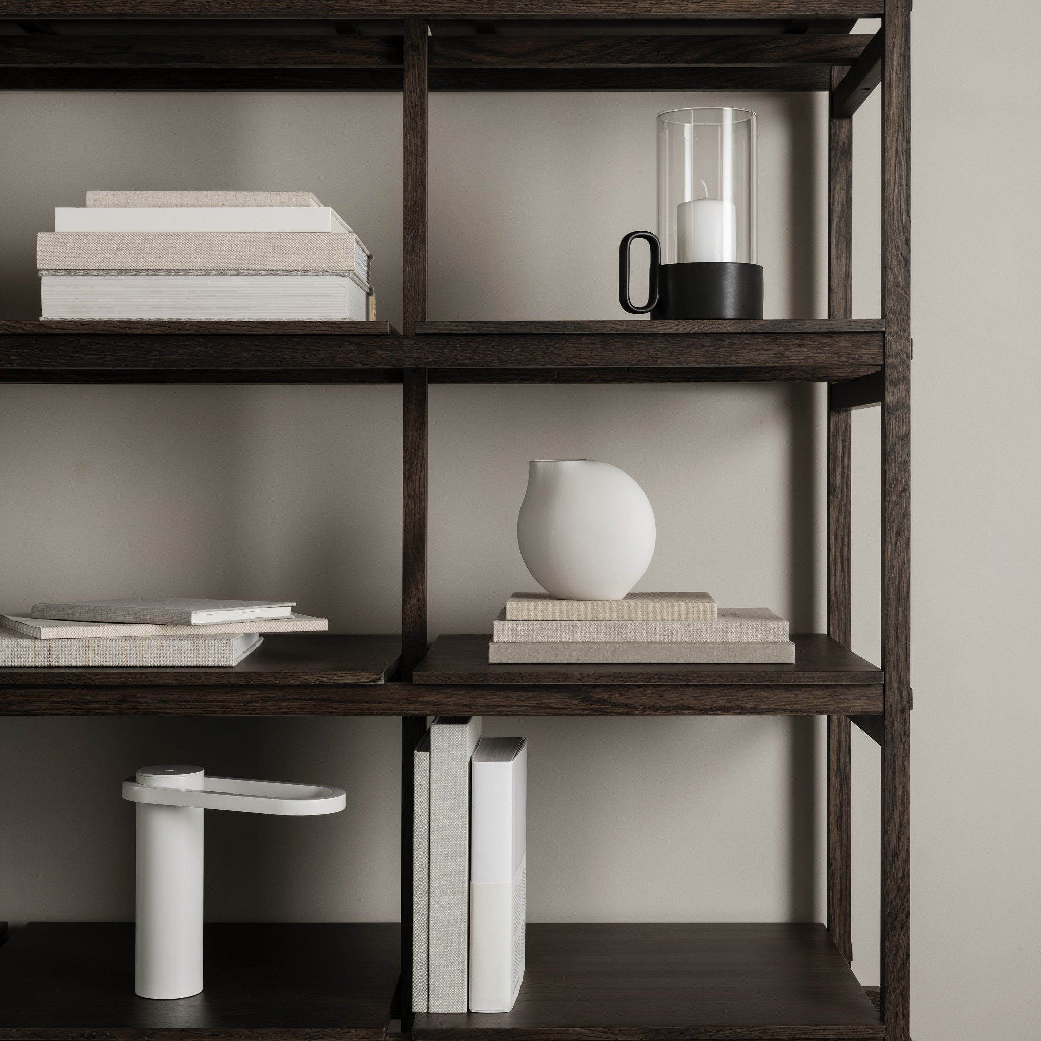modern ebony stained bookshelves with NONA vase by blomus