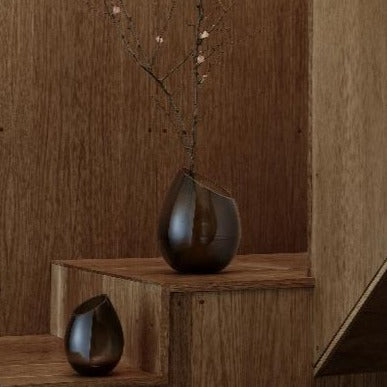 flowers arranged in DROP designer vase by blomus on wooden staircase