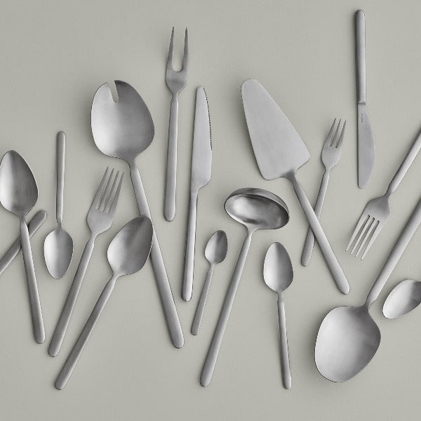 blomus STELLA brushed stainless cutlery arranged on a grey background