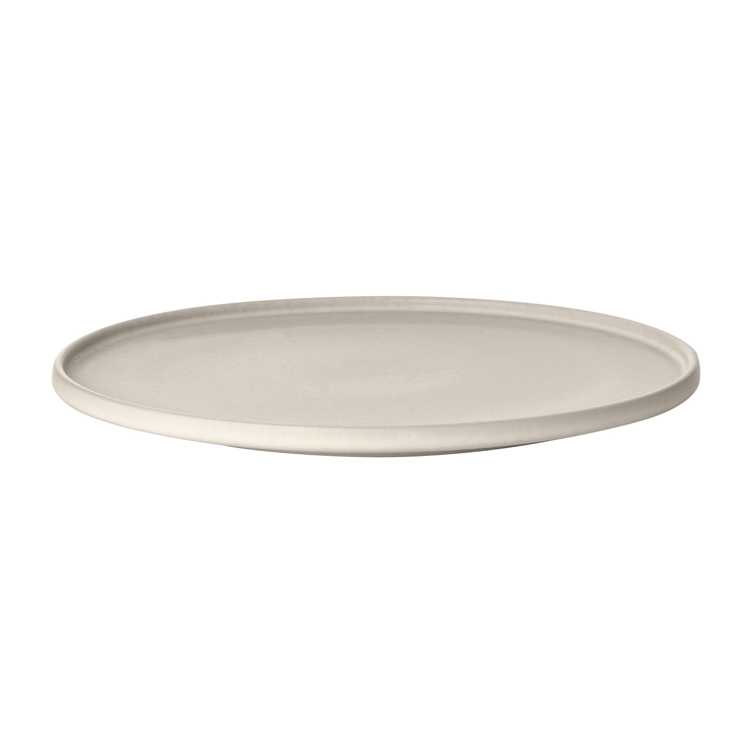 Round beige ceramic plate on a white background