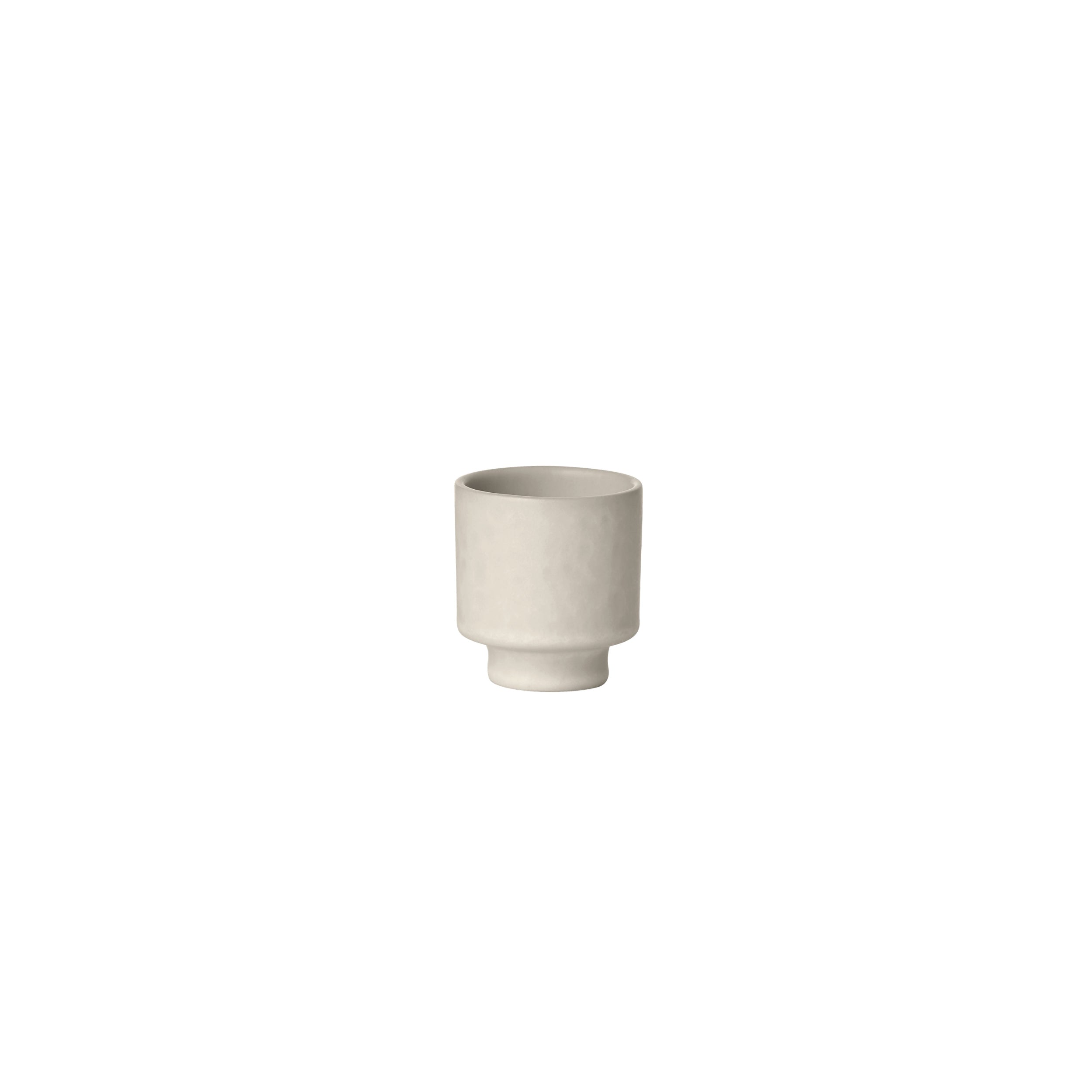White ceramic planter on a white background