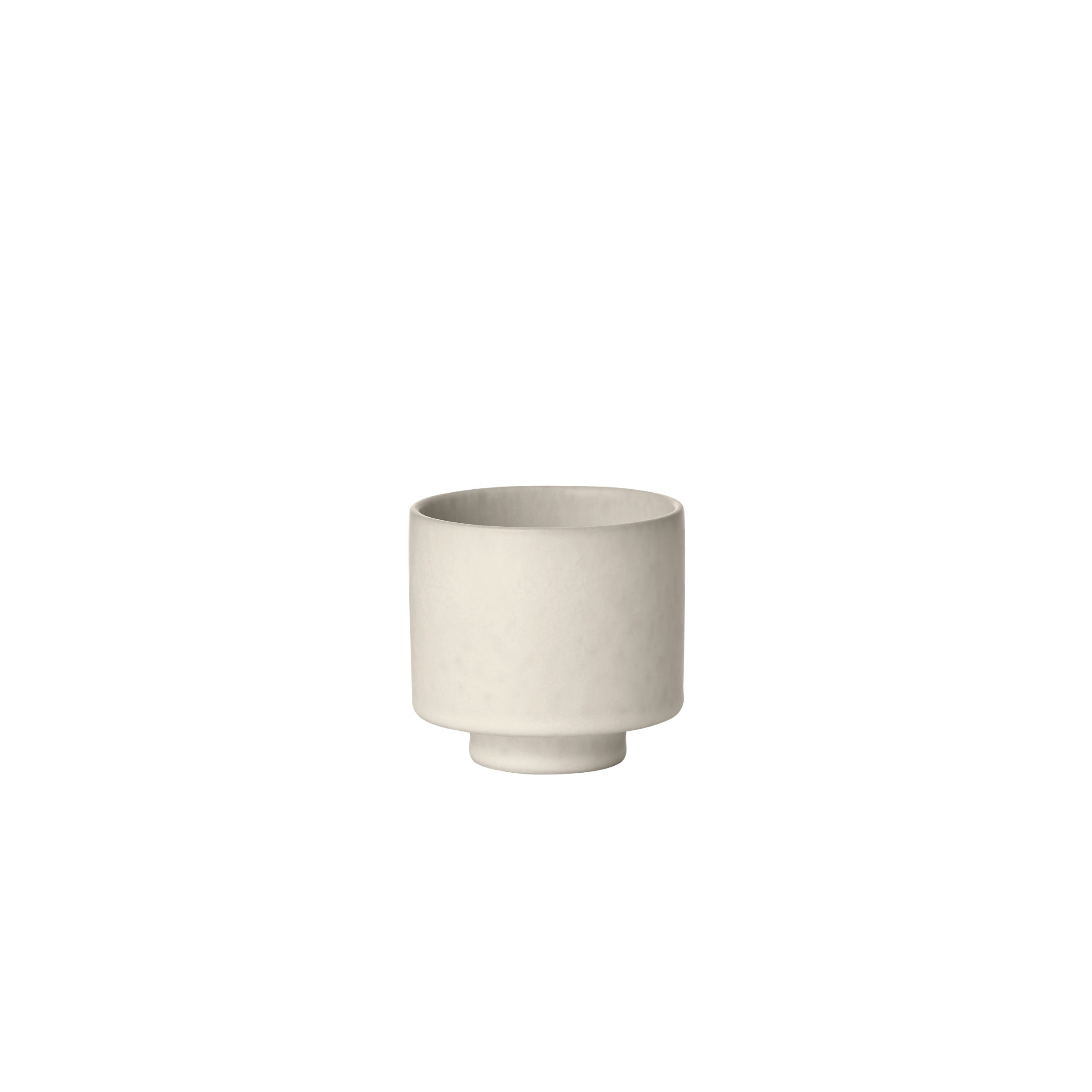 White ceramic planter on a white background