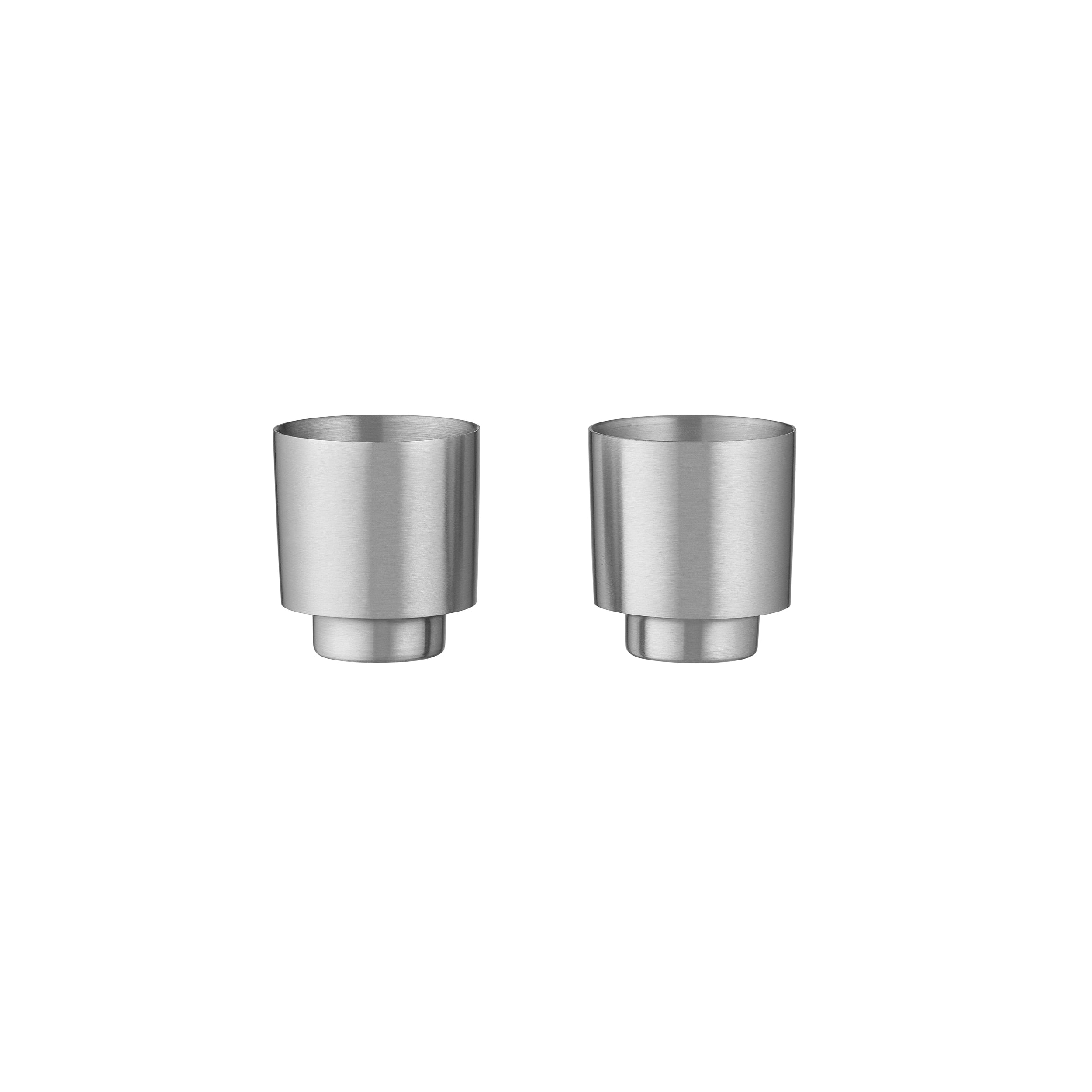 Two brushed stainless steel espresso cups shown side by side on a plain white background.